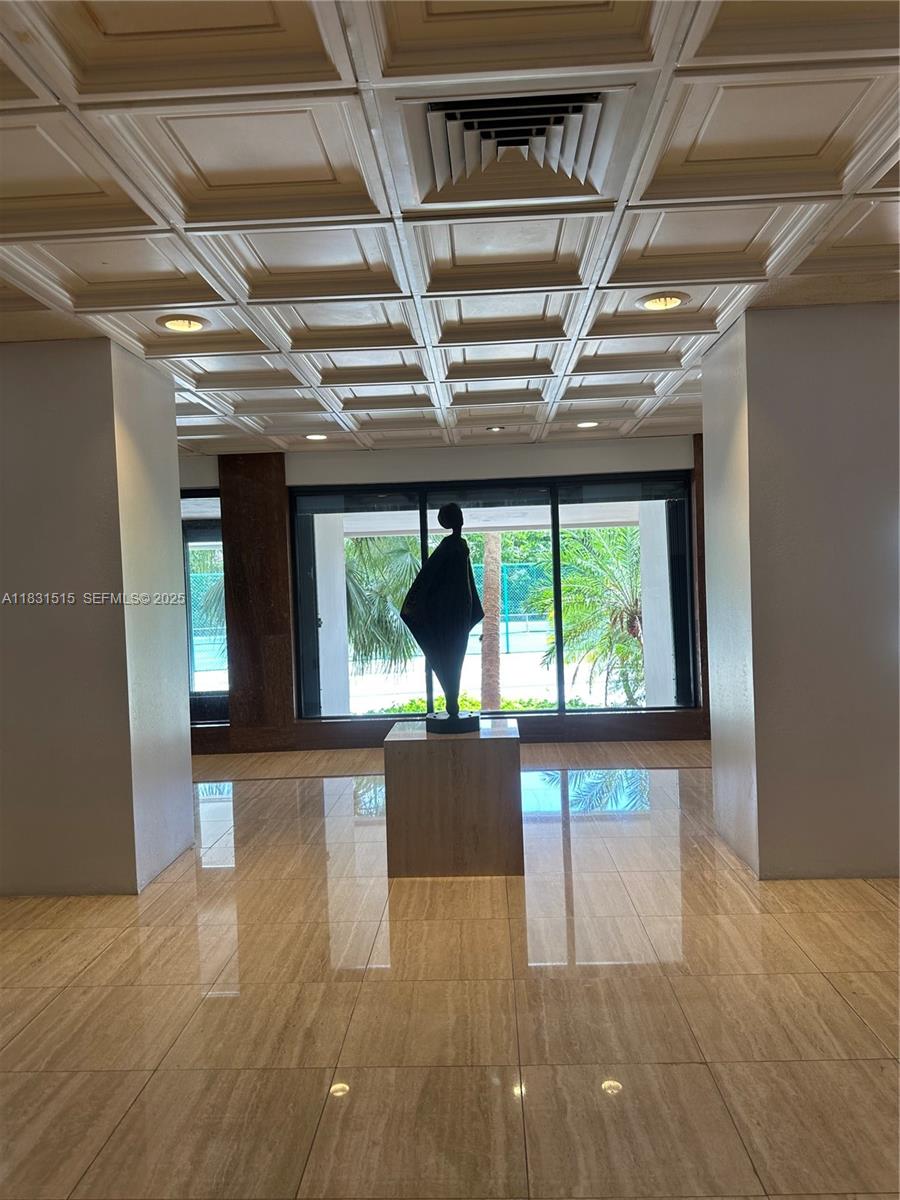 2333 Brickell Avenue, Unit 901 Miami, FL 33129 - Photo 8 of 79 a view of an empty room with wooden floor and a window