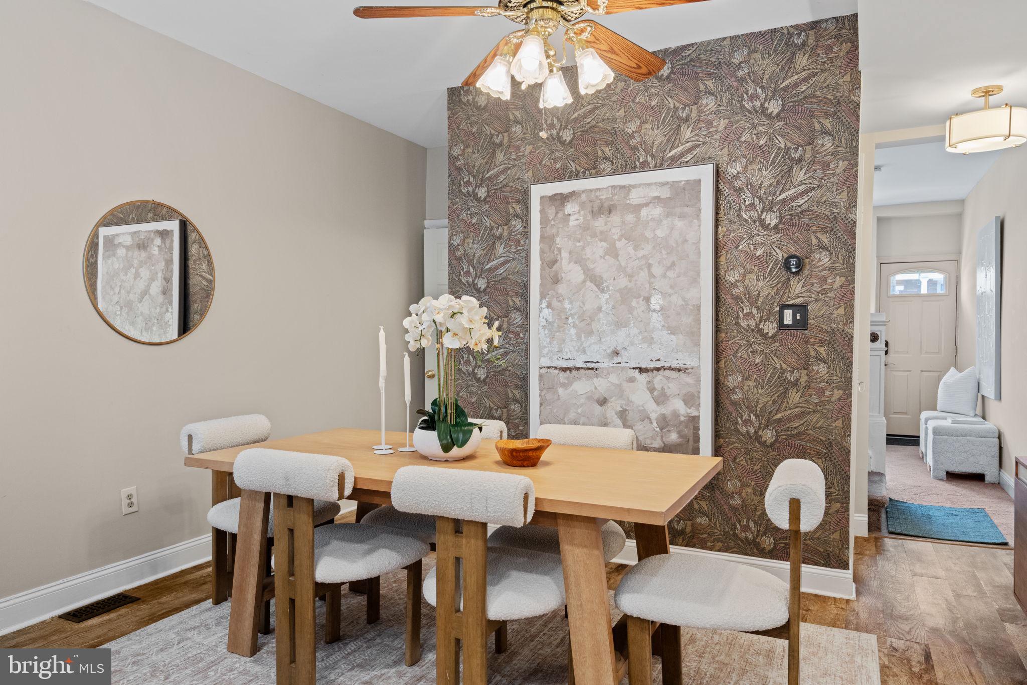 4092 Pechin Street Philadelphia, PA 19128 - Photo 4 of 28 a dining room with furniture a rug and a chandelier