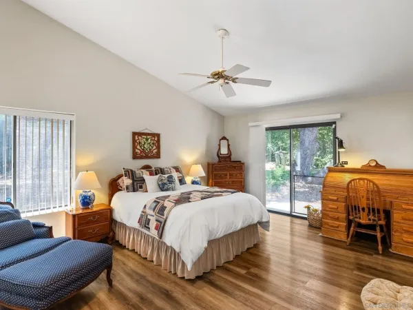 a bedroom with a bed a bed and a couch