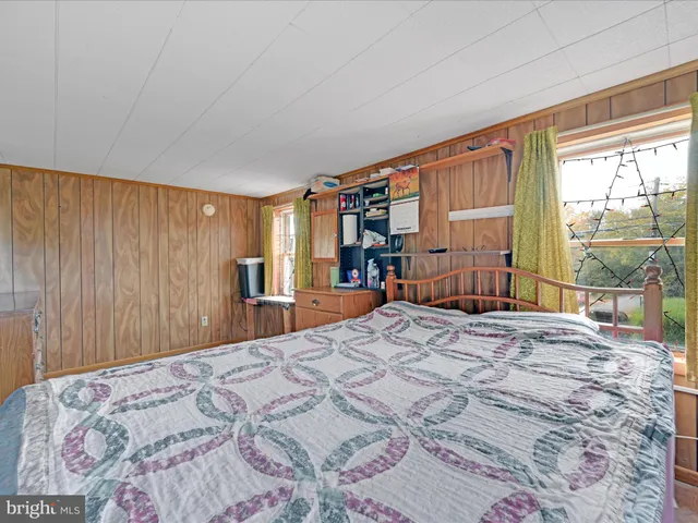 a bed room with a bed and a window