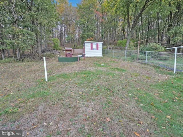 a view of a house with a tub and a fire pit