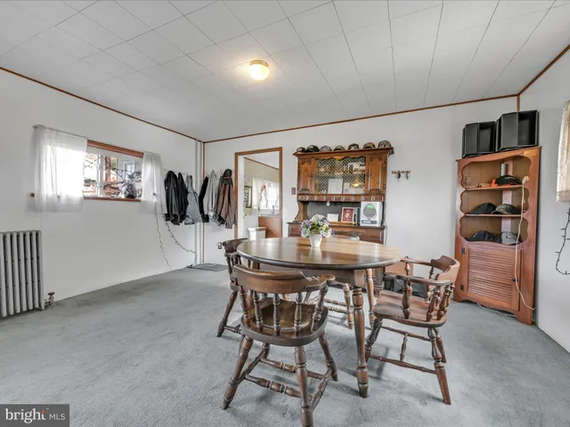 a view of a livingroom with furniture and windows