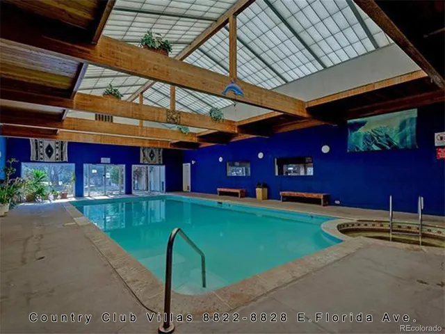 a view of a swimming pool with a patio