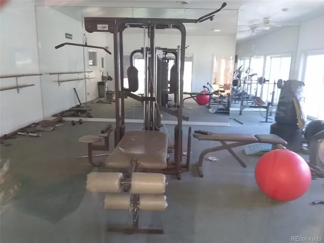 a room with lots of chairs and mirrors