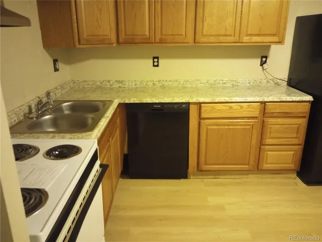 a bathroom with a sink and a washer dryer