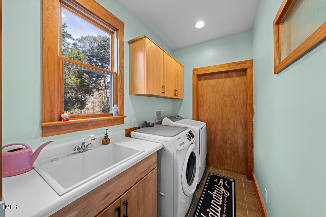 10714 Wilkins Road Rougemont, NC 27572 - Photo 15 of 40 a view of bathroom with a sink and a window
