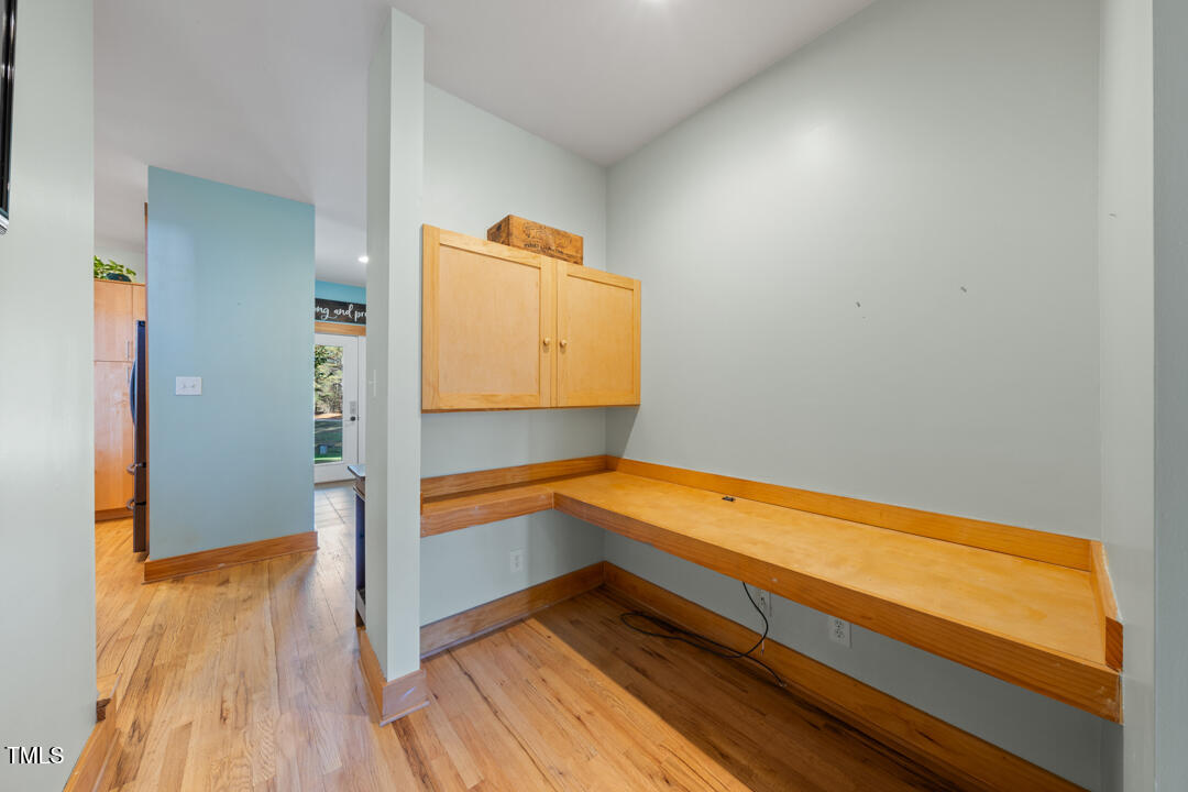 10714 Wilkins Road Rougemont, NC 27572 - Photo 17 of 40 a room with wooden floor and small bathroom