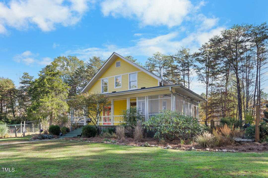 10714 Wilkins Road Rougemont, NC 27572 - Photo 28 of 40 a front view of a house with a yard