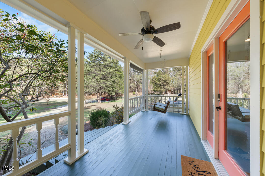 10714 Wilkins Road Rougemont, NC 27572 - Photo 3 of 40 a view of a porch with wooden floor and outdoor space