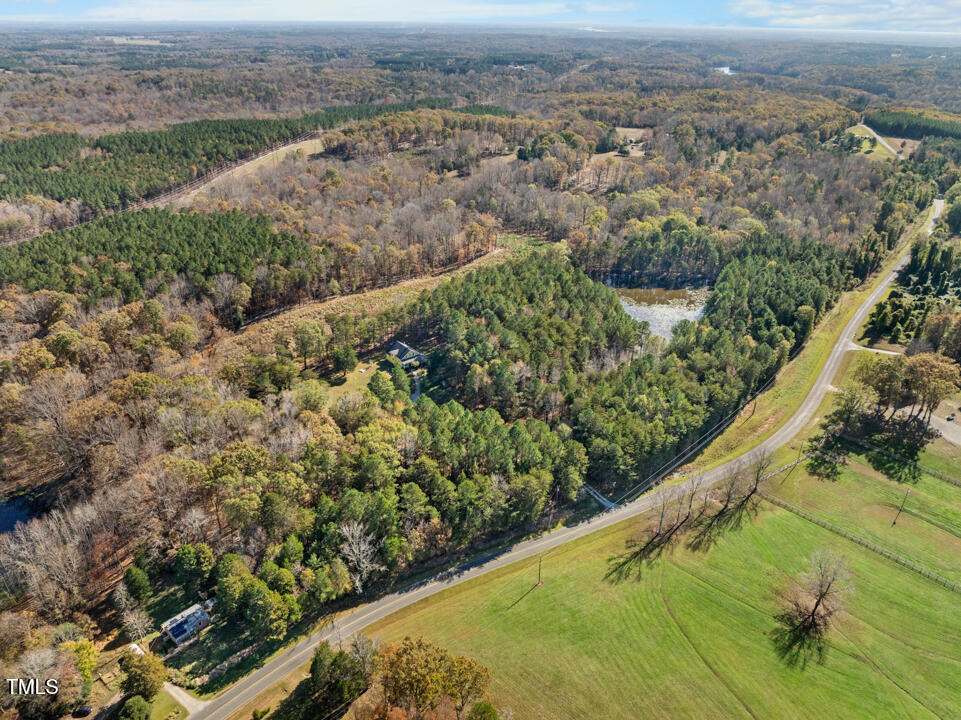 10714 Wilkins Road Rougemont, NC 27572 - Photo 34 of 40 an aerial view of residential houses with outdoor space