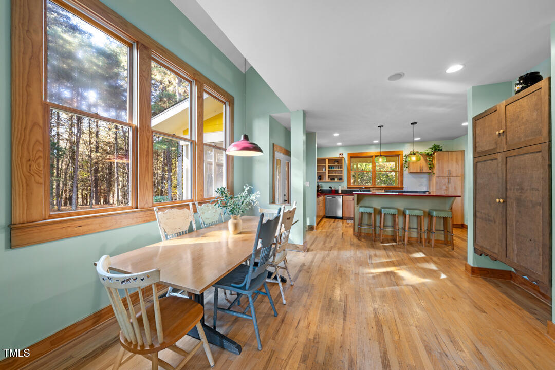 10714 Wilkins Road Rougemont, NC 27572 - Photo 7 of 40 a dining room with furniture water view and large windows
