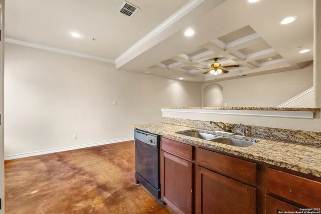 a kitchen with a sink and cabinets