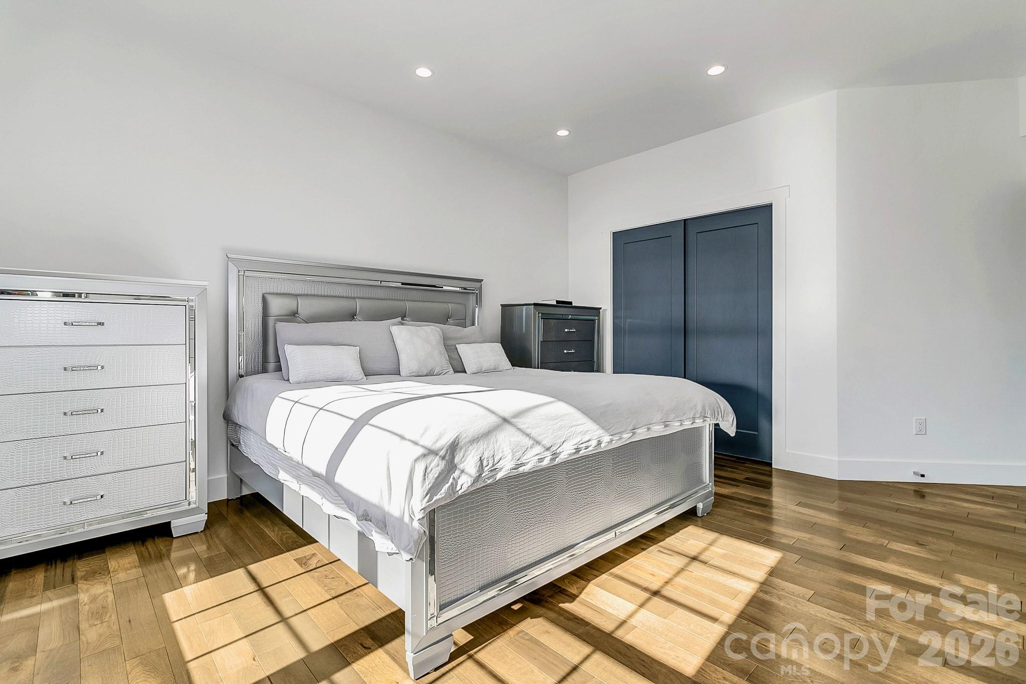 215 East Oakview Road Asheville, NC 28806 - Photo 22 of 42 a bedroom with a bed and a night stand