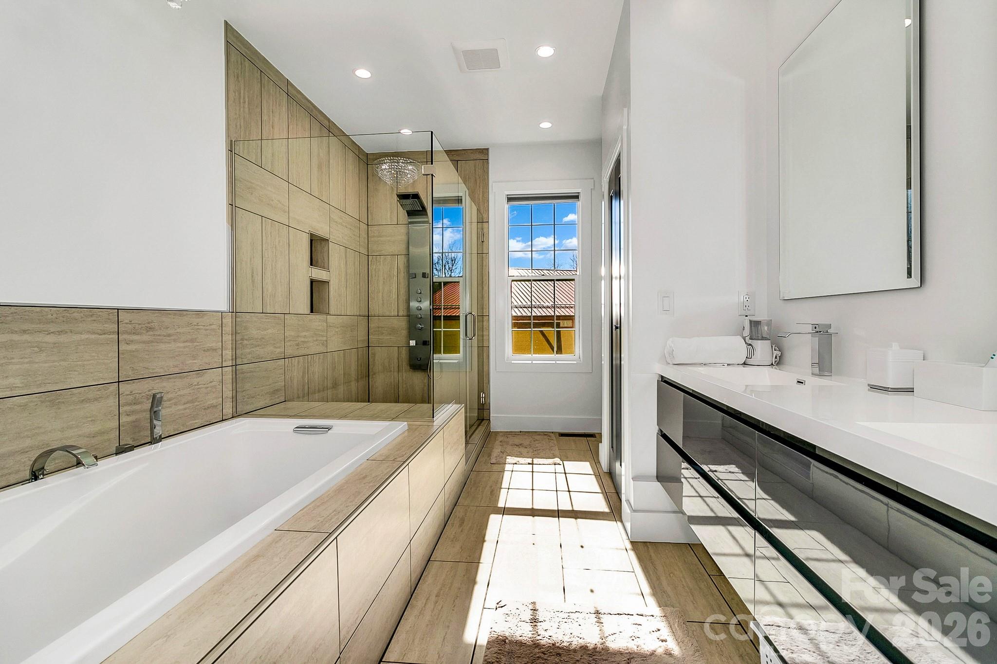 215 East Oakview Road Asheville, NC 28806 - Photo 24 of 42 a bathroom with a bathtub and double vanity