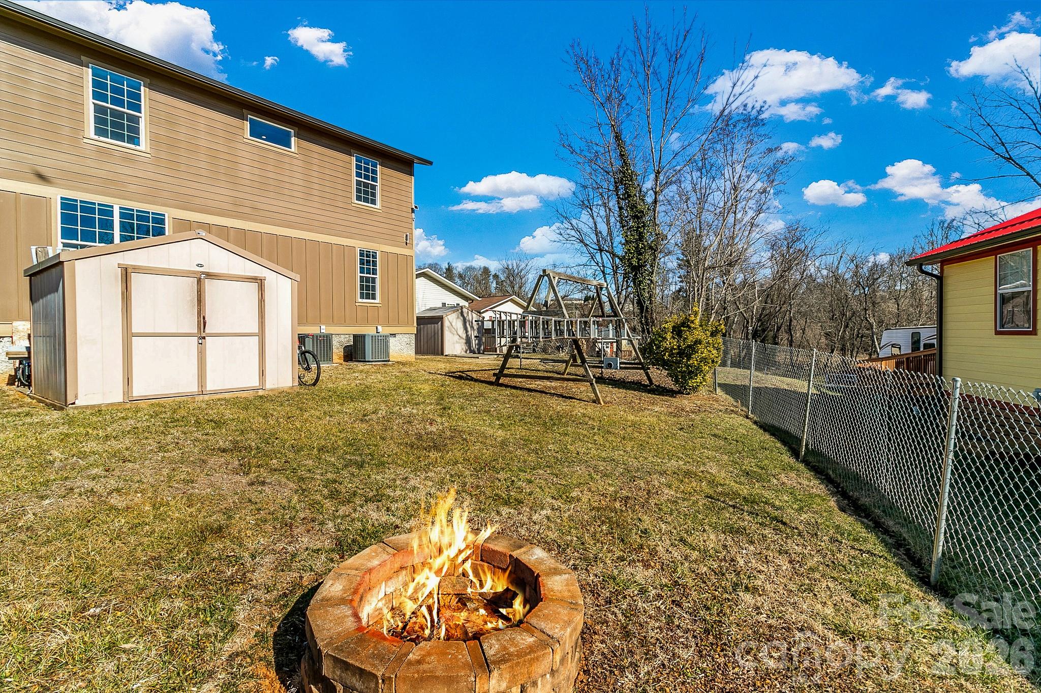 215 East Oakview Road Asheville, NC 28806 - Photo 40 of 42 a view of a backyard with large trees