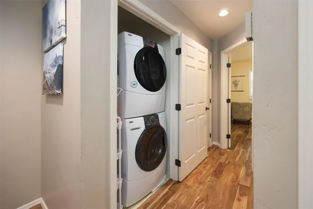 a view of a hallway with washer and dryer