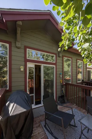 a view of a two chairs in the patio