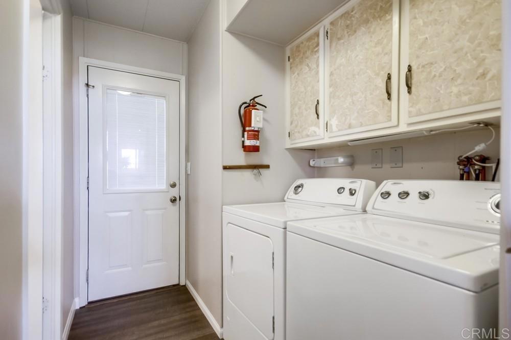 9500 Harritt Road, Unit 70 Lakeside, CA 92040 - Photo 13 of 21 a view of washer and dryer with kitchen in the background
