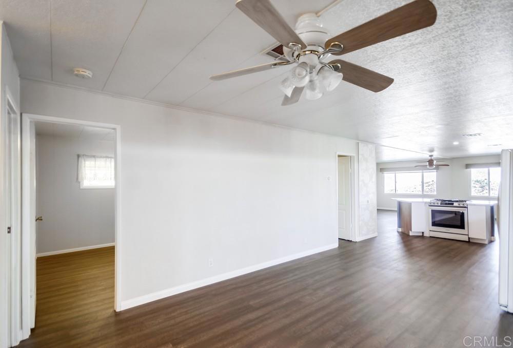 9500 Harritt Road, Unit 70 Lakeside, CA 92040 - Photo 7 of 21 wooden floor in an empty room with a window