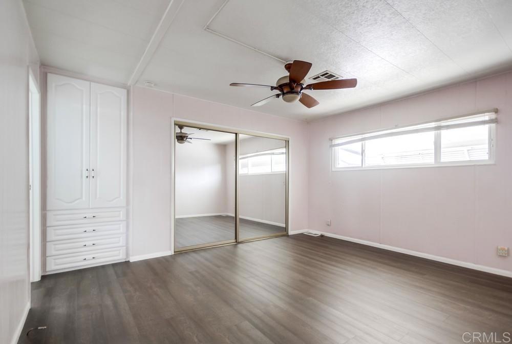 9500 Harritt Road, Unit 70 Lakeside, CA 92040 - Photo 9 of 21 wooden floor in an empty room with a window