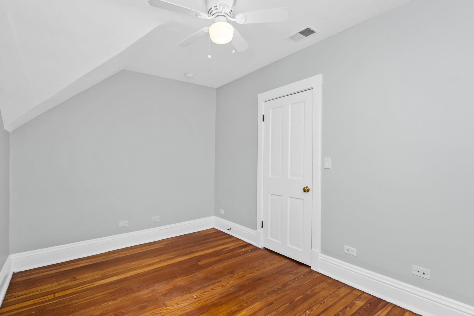 1116 Darrow Avenue, Unit 2F Evanston, IL 60202 - Photo 11 of 15 a view of room with wooden floor and ceiling fan