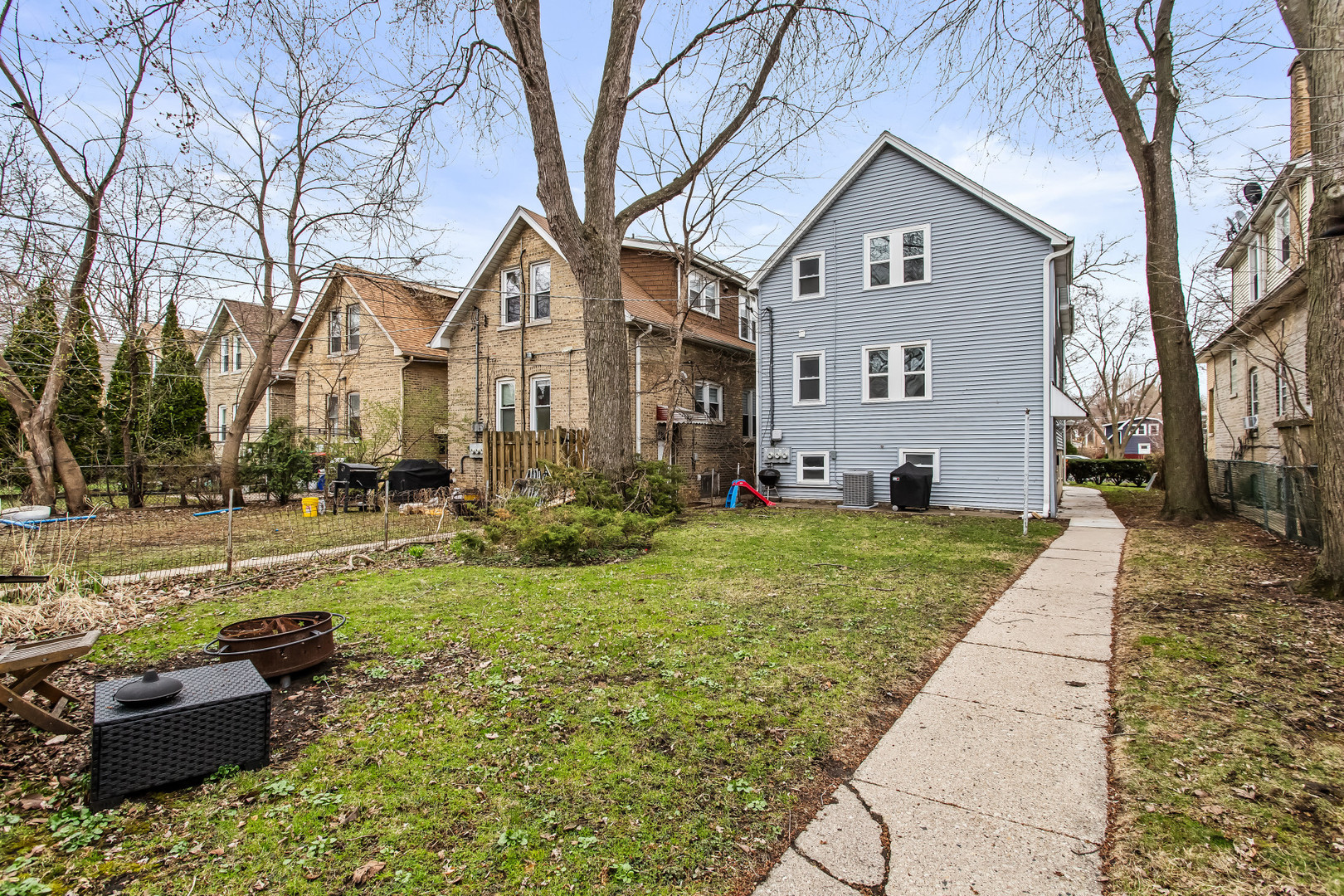 1116 Darrow Avenue, Unit 2F Evanston, IL 60202 - Photo 14 of 15 a front view of a house with a yard and trees