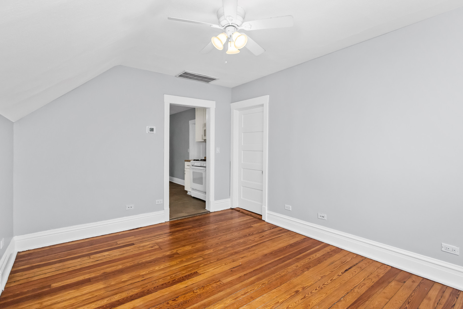 1116 Darrow Avenue, Unit 2F Evanston, IL 60202 - Photo 3 of 15 wooden floor in an empty room