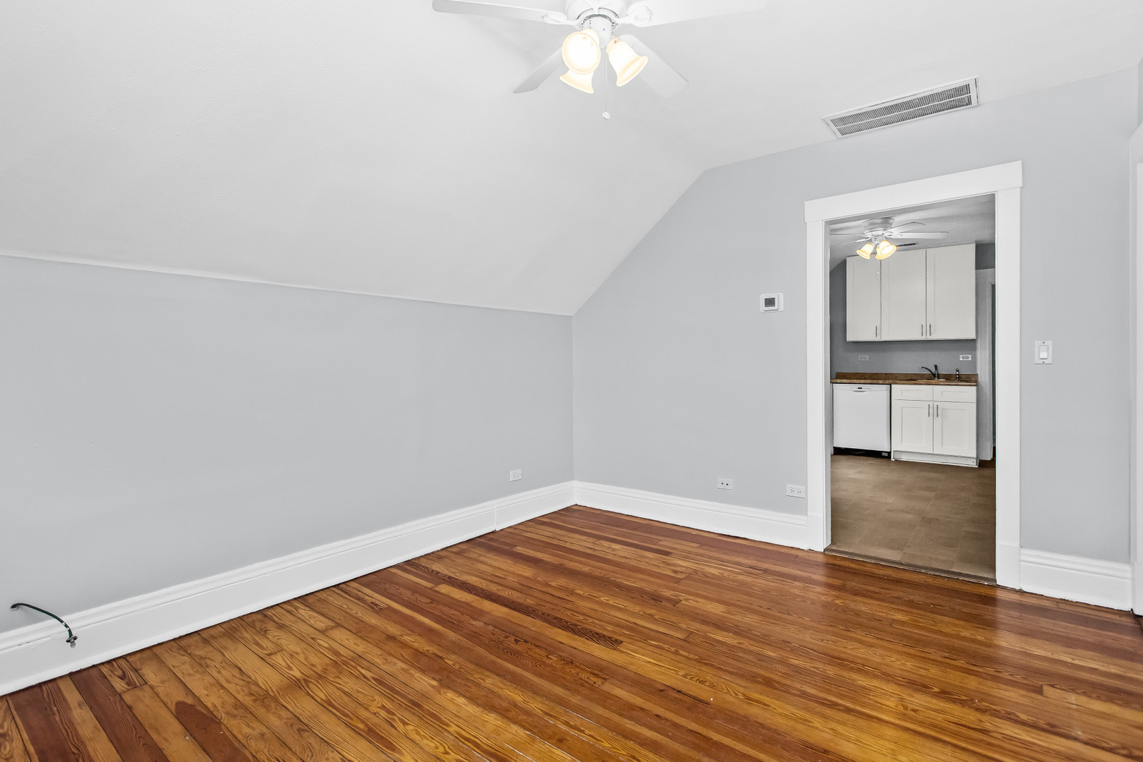 1116 Darrow Avenue, Unit 2F Evanston, IL 60202 - Photo 4 of 15 wooden floor in an empty room