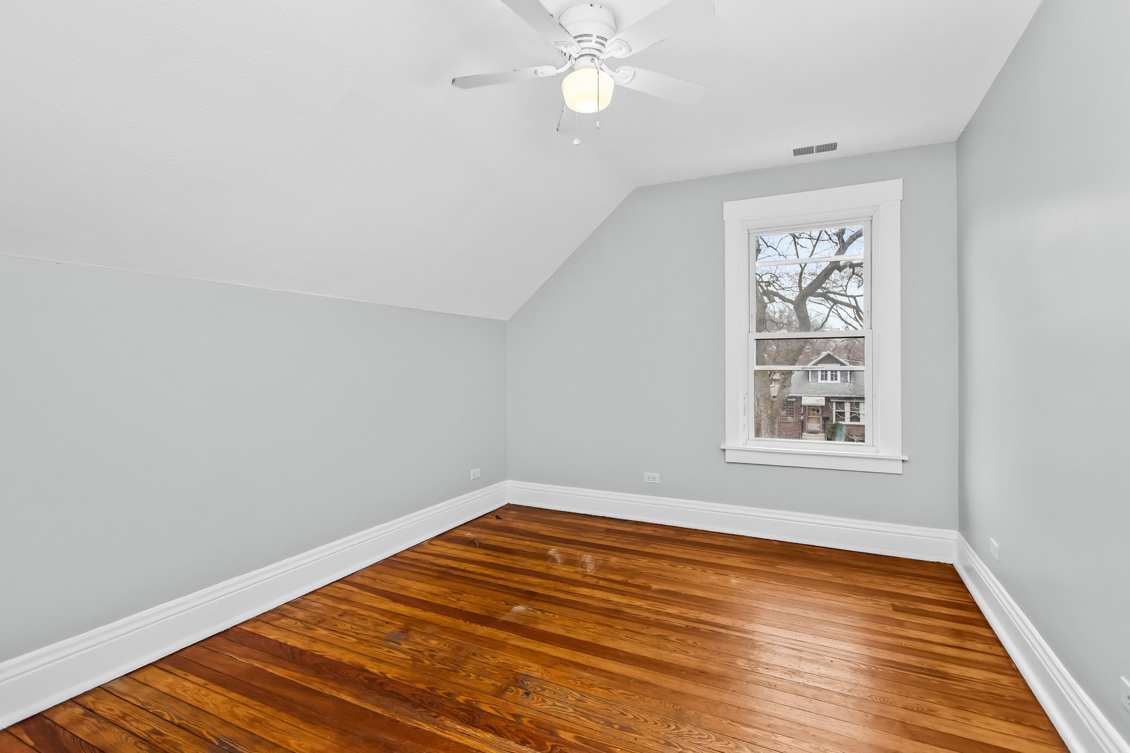 1116 Darrow Avenue, Unit 2F Evanston, IL 60202 - Photo 8 of 15 wooden floor in an empty room with a window
