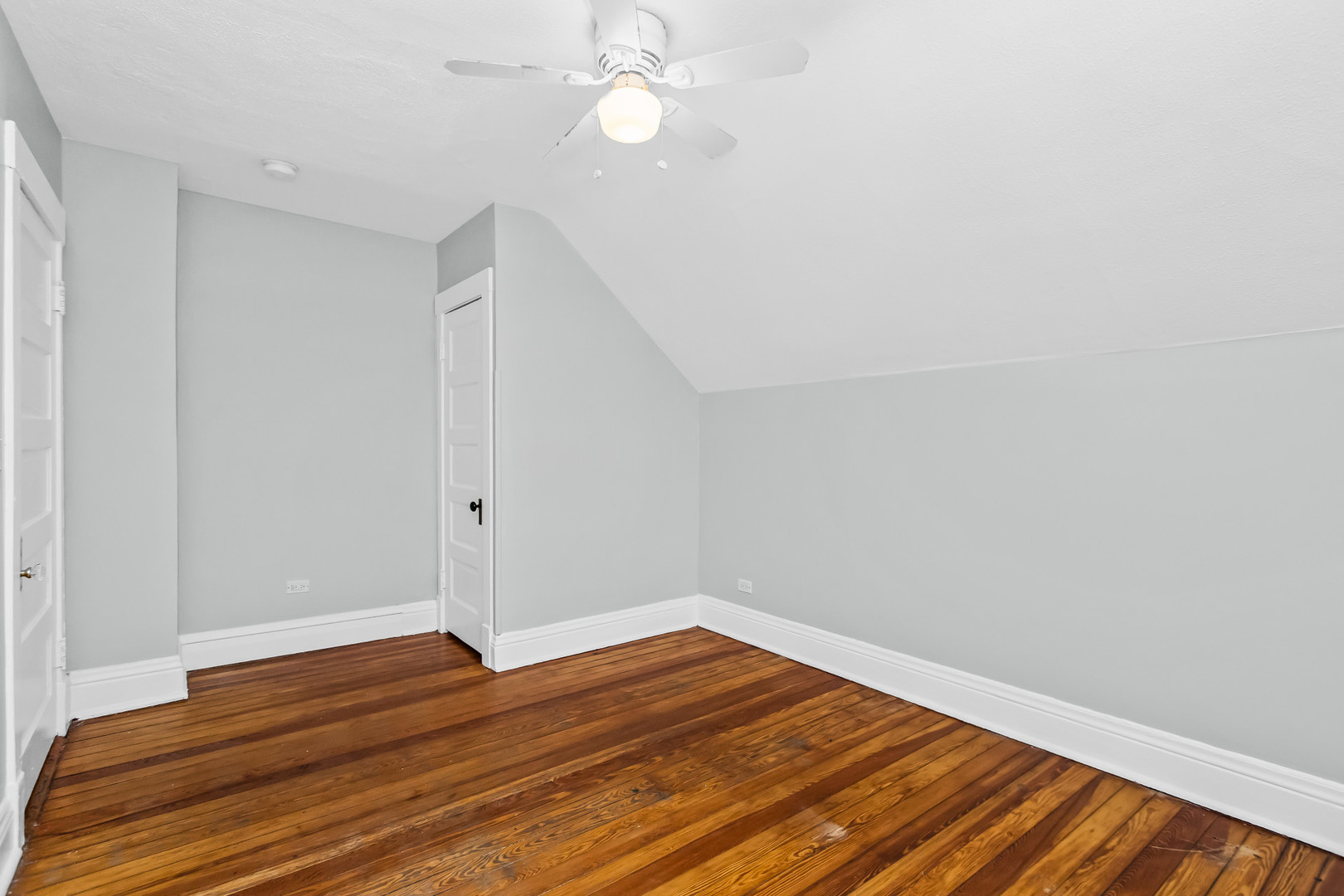 1116 Darrow Avenue, Unit 2F Evanston, IL 60202 - Photo 9 of 15 a view of room with wooden floor and ceiling fan