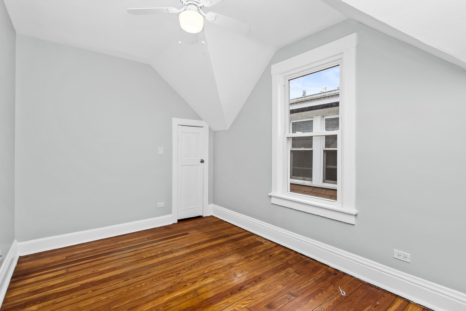 1116 Darrow Avenue, Unit 2F Evanston, IL 60202 - Photo 10 of 15 an empty room with wooden floor and windows
