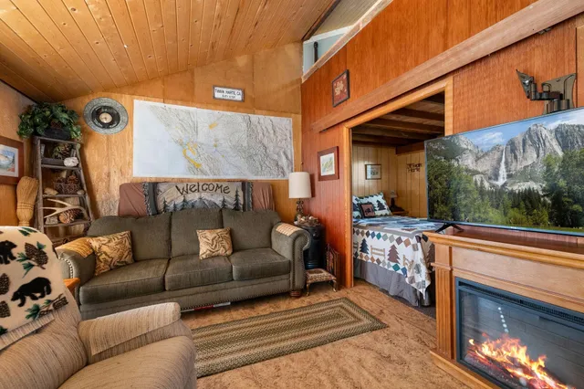 a outdoor living space with patio furniture and a fireplace