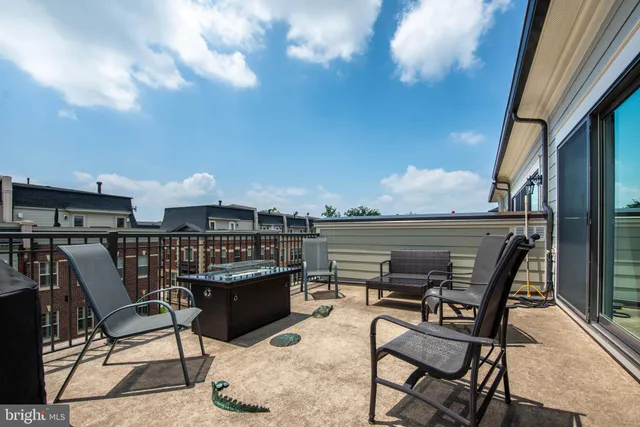 a view of a terrace with furniture and stove