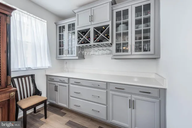 a kitchen with a window and chairs