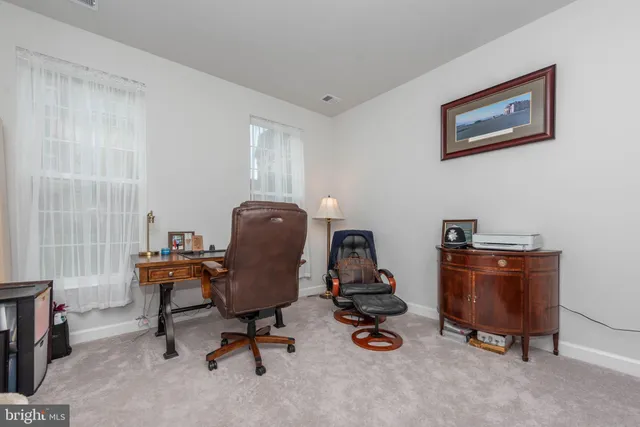 a view of a workspace with furniture