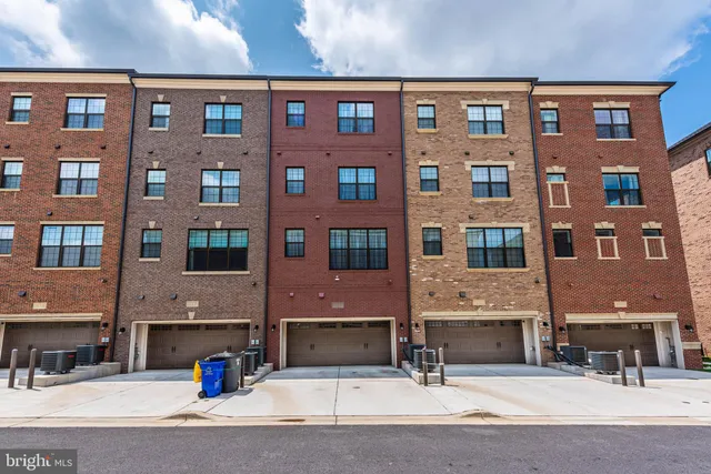 a view of a brick building with many windows
