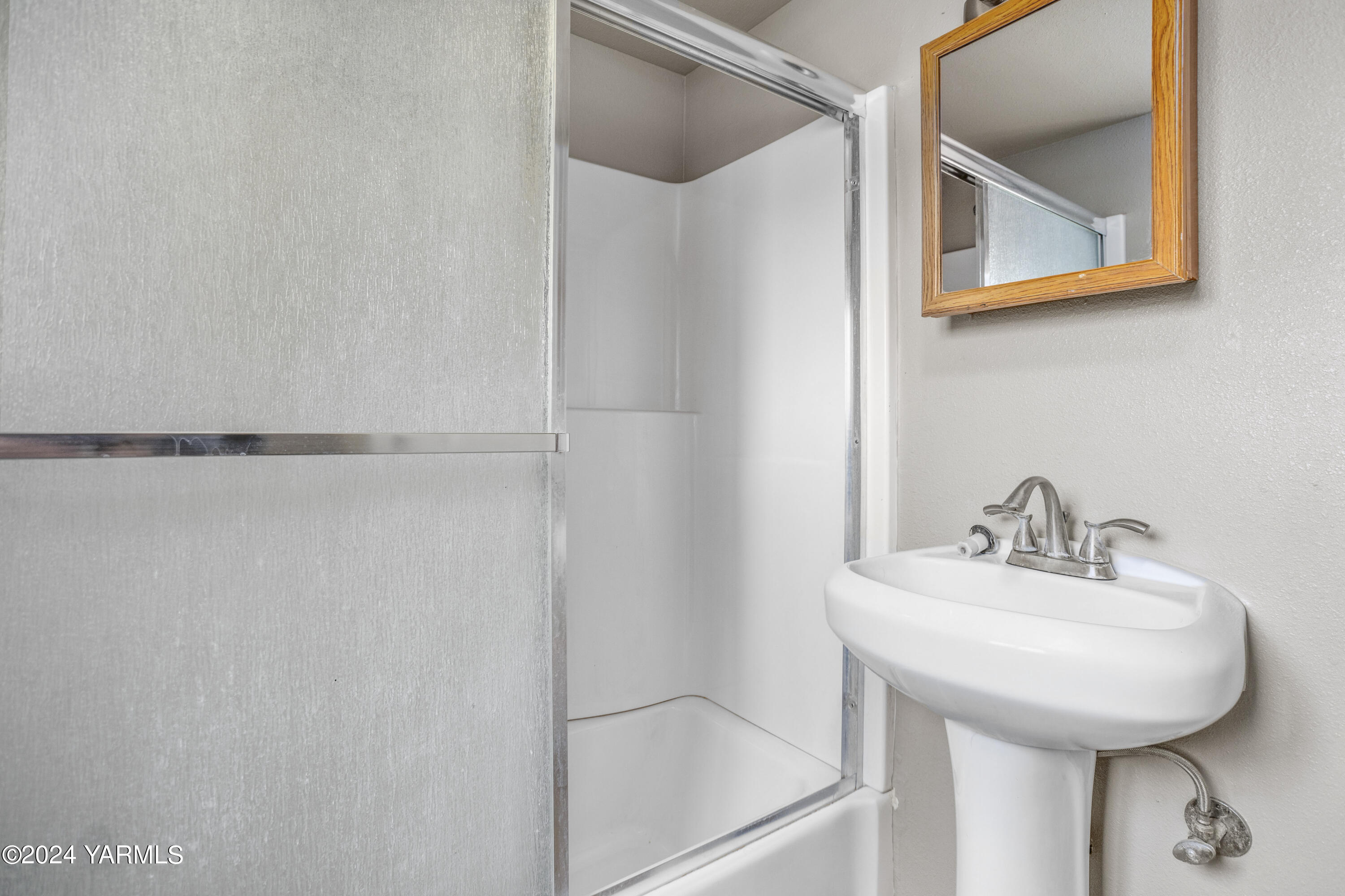 178409 West Apricot Road Grandview, WA 98930 - Photo 33 of 43 a bathroom with a sink and mirror