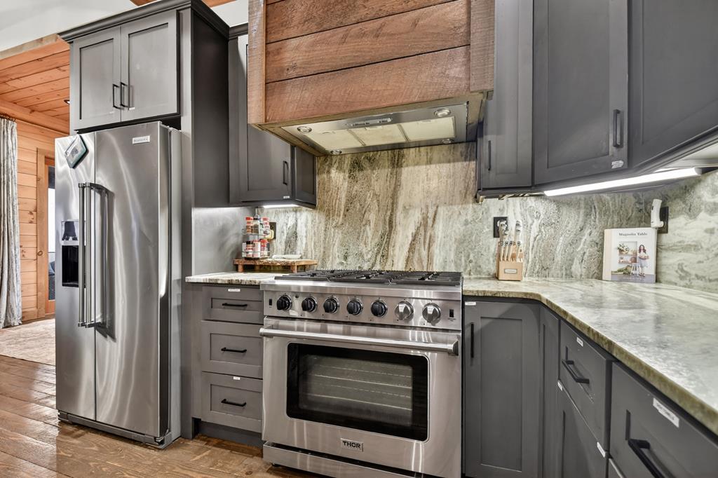 472 Overlook Drive Blue Ridge, GA 30513 - Photo 11 of 58 a kitchen with stainless steel appliances granite countertop a stove and a refrigerator