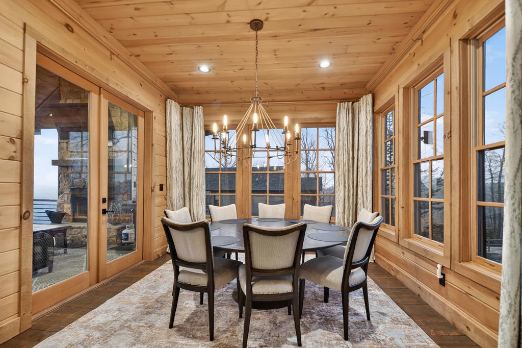 472 Overlook Drive Blue Ridge, GA 30513 - Photo 13 of 58 a view of a dining room with furniture large windows and wooden floor
