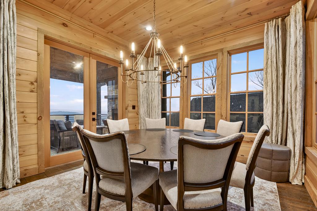 472 Overlook Drive Blue Ridge, GA 30513 - Photo 14 of 58 a dining room with furniture a chandelier and wooden floor