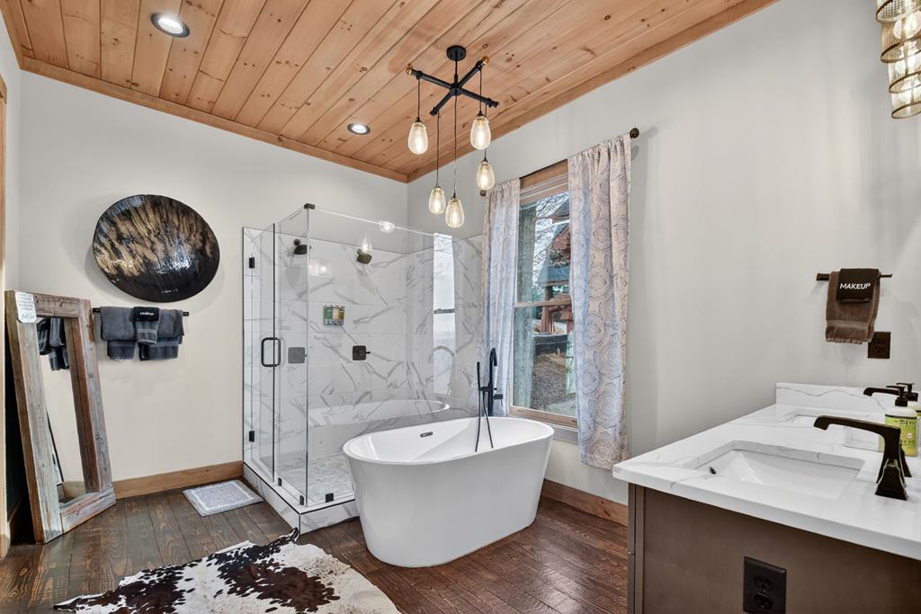 472 Overlook Drive Blue Ridge, GA 30513 - Photo 16 of 58 a bathroom with a sink a toilet and shower