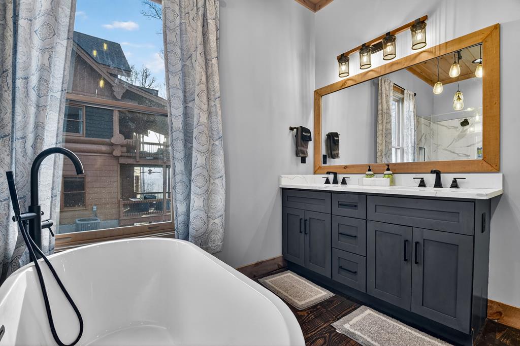 472 Overlook Drive Blue Ridge, GA 30513 - Photo 19 of 58 a bathroom with a sink and a mirror