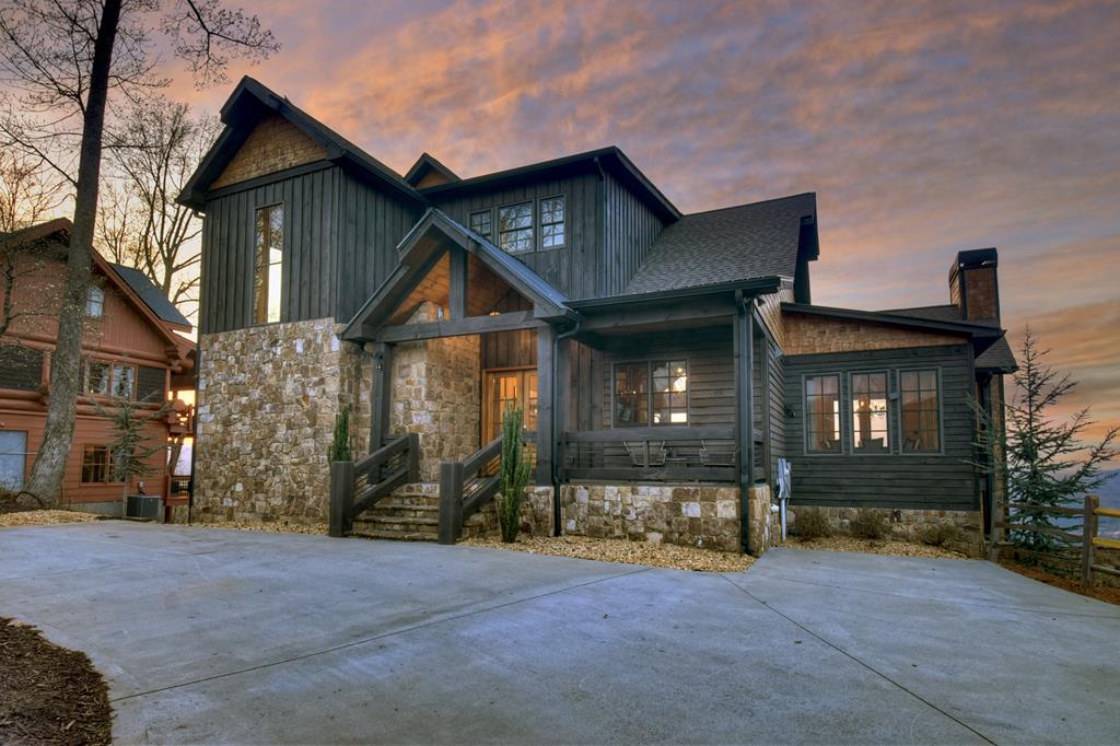 472 Overlook Drive Blue Ridge, GA 30513 - Photo 2 of 58 a front view of a house with a yard and garage