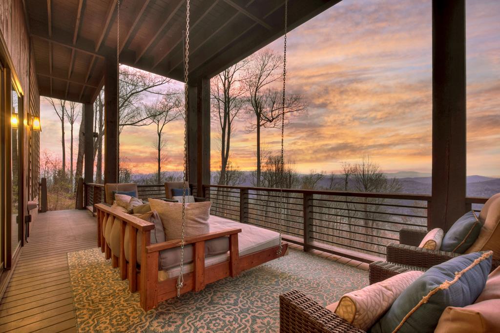 472 Overlook Drive Blue Ridge, GA 30513 - Photo 21 of 58 a balcony with furniture and a couch