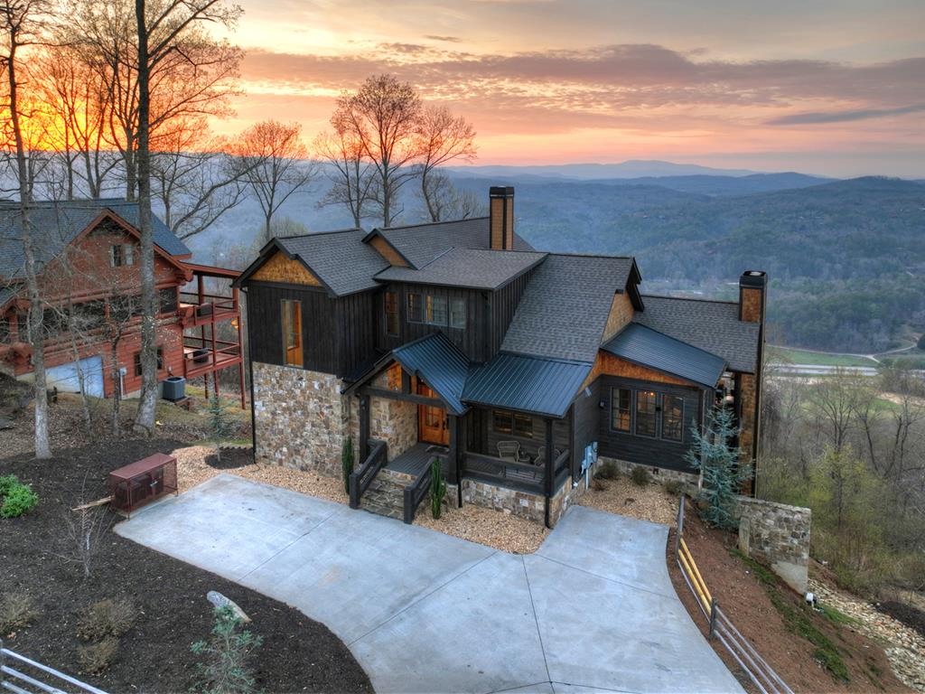 472 Overlook Drive Blue Ridge, GA 30513 - Photo 25 of 58 a view of a patio with table and chairs and potted plants