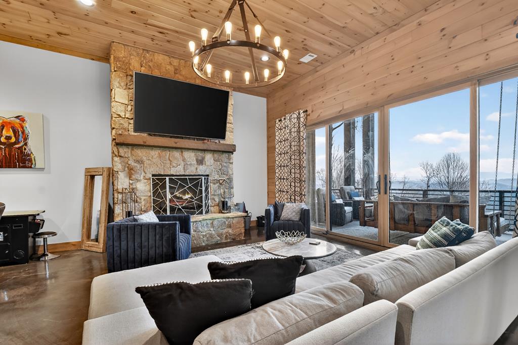 472 Overlook Drive Blue Ridge, GA 30513 - Photo 35 of 58 a living room with furniture fireplace and flat screen tv