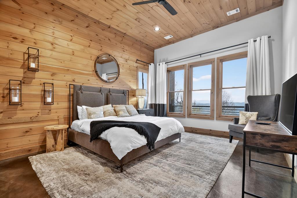 472 Overlook Drive Blue Ridge, GA 30513 - Photo 40 of 58 a bedroom with a large bed and a desk