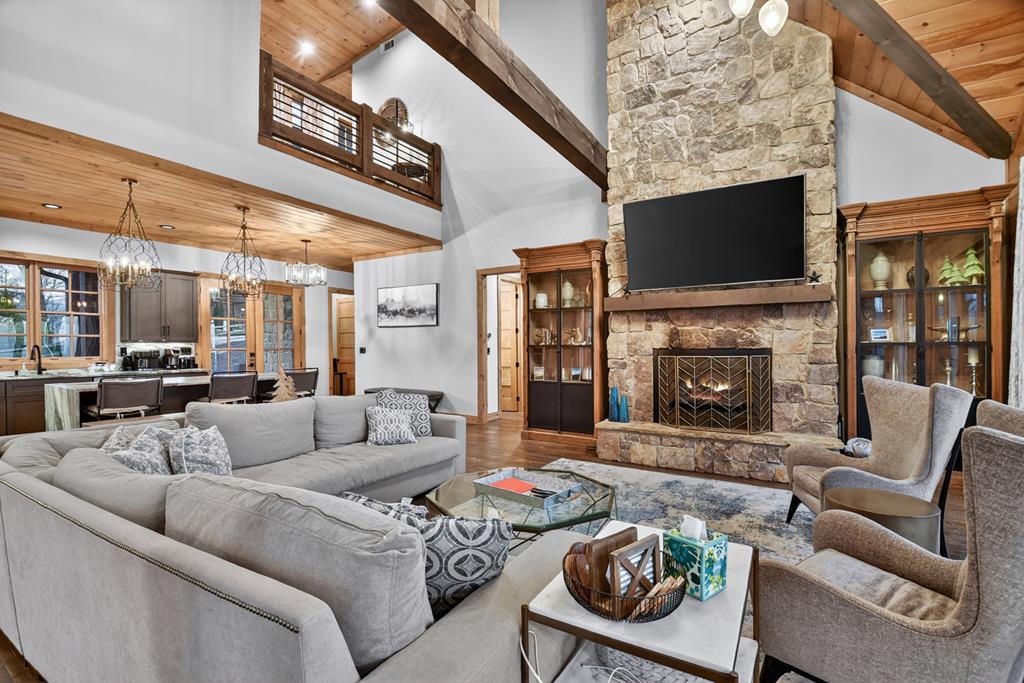 472 Overlook Drive Blue Ridge, GA 30513 - Photo 6 of 58 a living room with furniture a flat screen tv and a fireplace