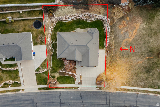 240 Bugle Way Providence, UT 84332 - Photo 9 of 15 Aerial view showcasing a property with a grey roof and a concrete driveway
