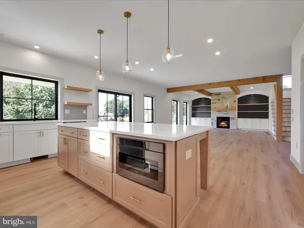 a kitchen with stainless steel appliances granite countertop a stove and a sink